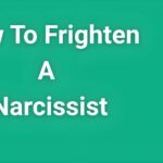 Person standing confidently with arms crossed, representing emotional independence and boundary-setting against narcissistic manipulation