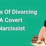 Woman reading legal documents during covert narcissist divorce stages with support resources and emotional recovery materials on desk